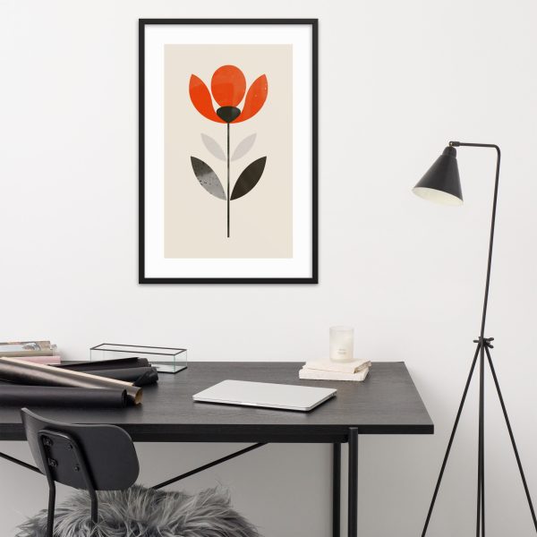 Minimalist office with framed floral artwork.