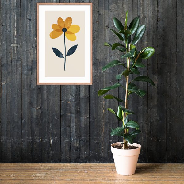 A framed flower illustration hangs on a dark wooden wall next to a tall potted plant.