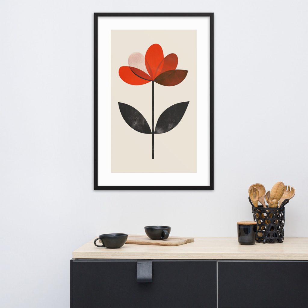 A framed abstract flower artwork hangs above a modern black sideboard with minimalist decor.