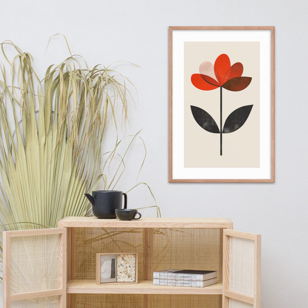 A minimalist room with a framed flower artwork, a plant, and a teapot set on a cabinet.