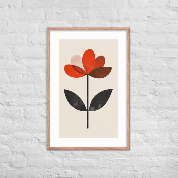 Minimalist art print of a red and black flower in a wooden frame against a white brick wall.