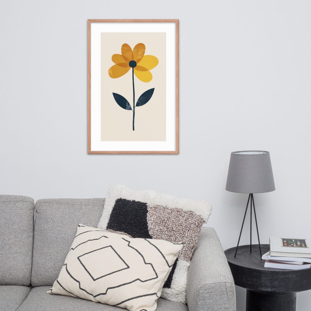 A minimalist room with a framed flower artwork above a gray couch and a gray lamp on a side table.