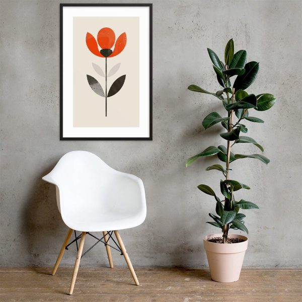 Modern chair and potted plant beside framed flower artwork on wall.