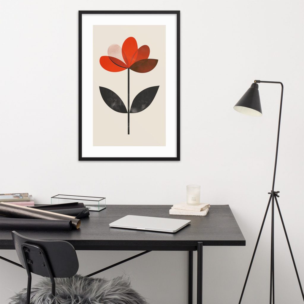 Minimalist workspace with a flower artwork on the wall.