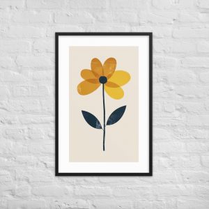 A framed picture of a yellow flower with two green leaves against a white brick wall.