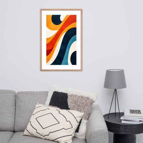 A framed abstract painting with colorful waves on a wall above a grey couch.
