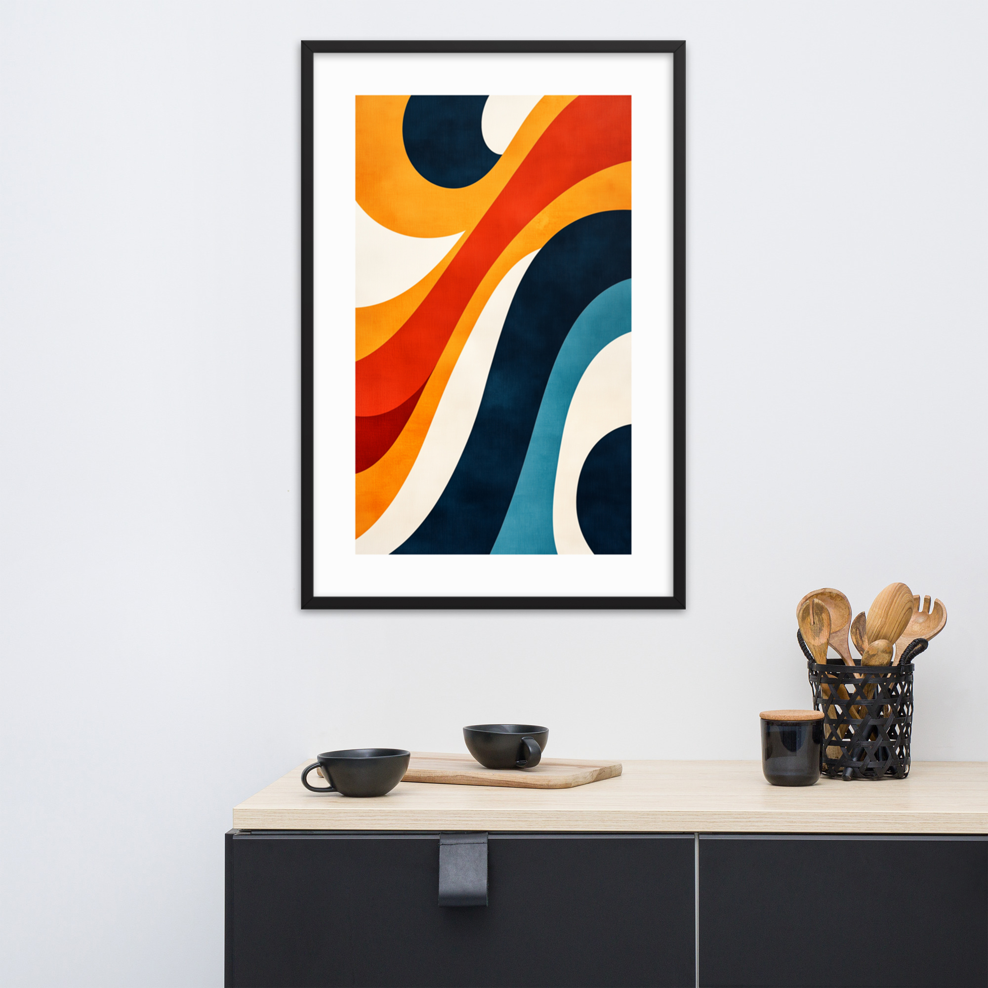 Abstract colorful waves artwork framed on a wall above a kitchen counter.