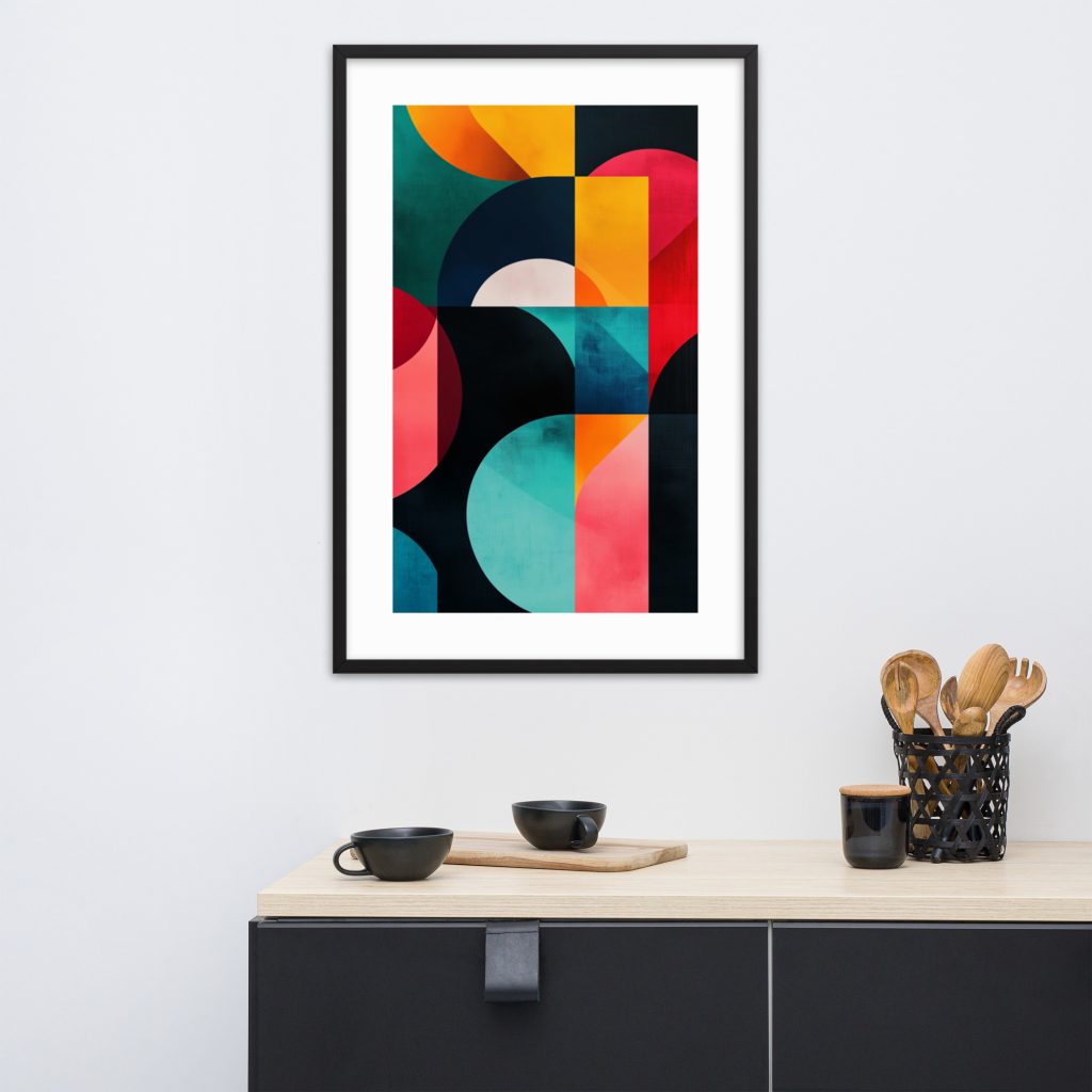 Framed colorful geometric abstract painting on a white wall above a minimalist cabinet with cups and utensils.