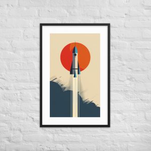 Framed graphic artwork of a rocket with an orange circle on a white brick wall.