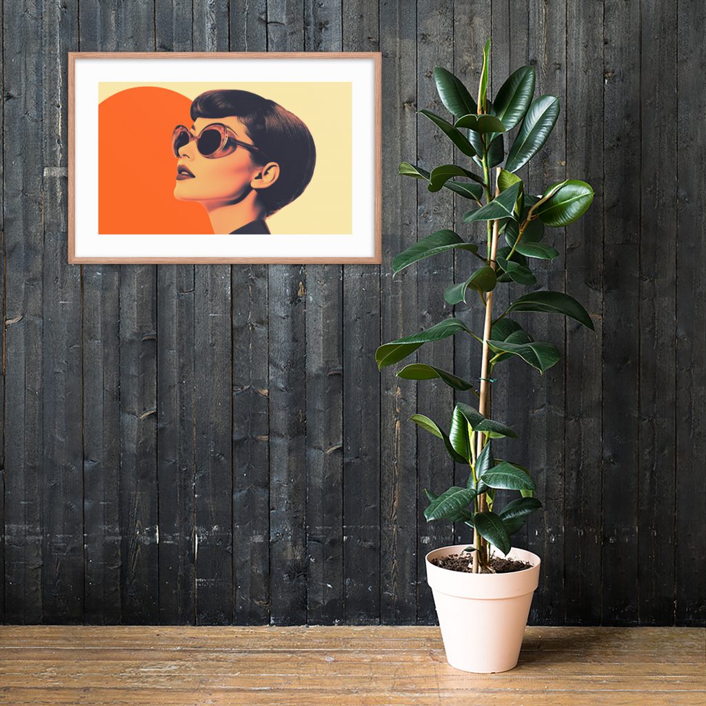 A framed modern artwork and potted plant against a dark wooden wall.