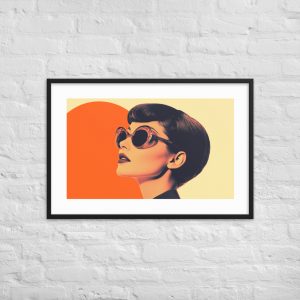 A framed pop art print of a woman with sunglasses and a bold orange and yellow background.