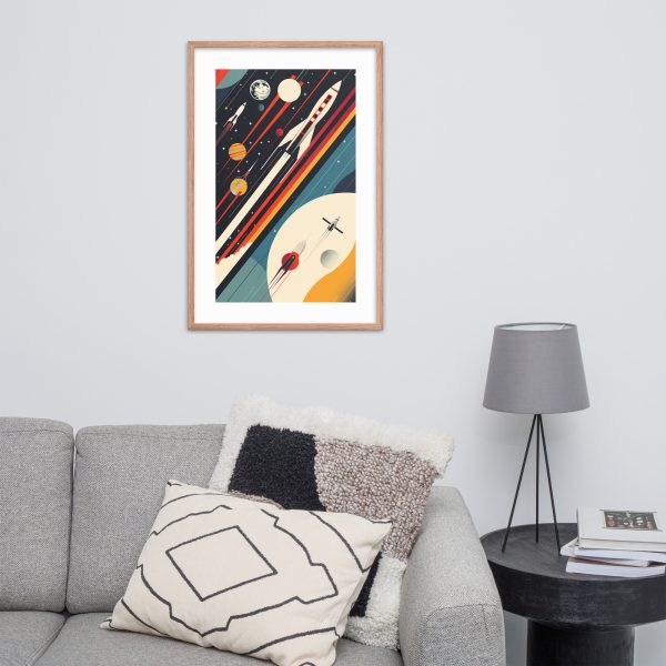 Framed abstract space-themed artwork on white wall above a gray sofa with modern cushions.