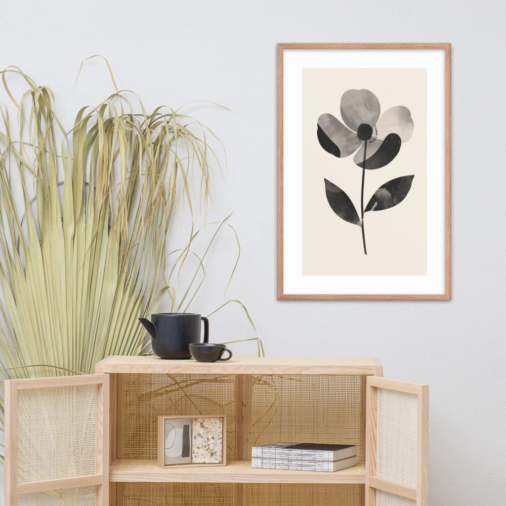 Minimalist room with framed flower art, wooden cabinet, black teapot, and dried plant.
