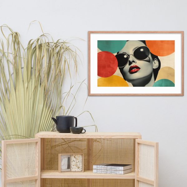 Framed modern art portrait above a cabinet with rattan doors