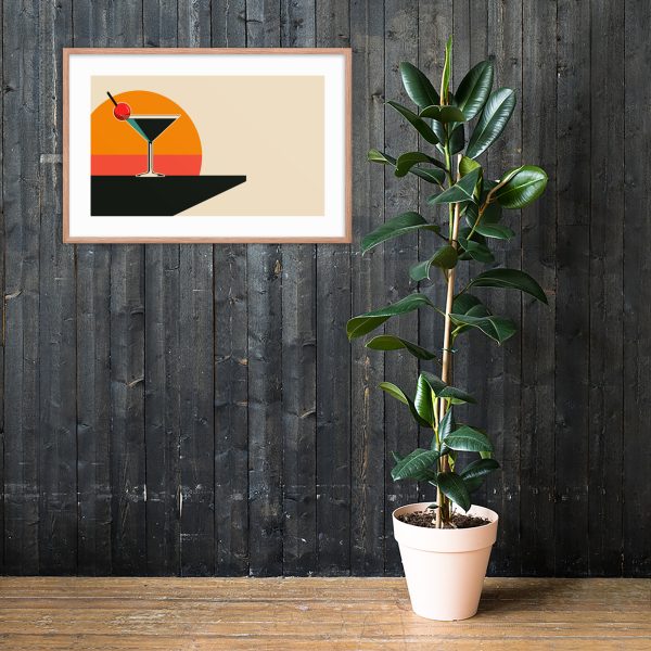 A potted plant beside a framed artwork on a dark wooden wall