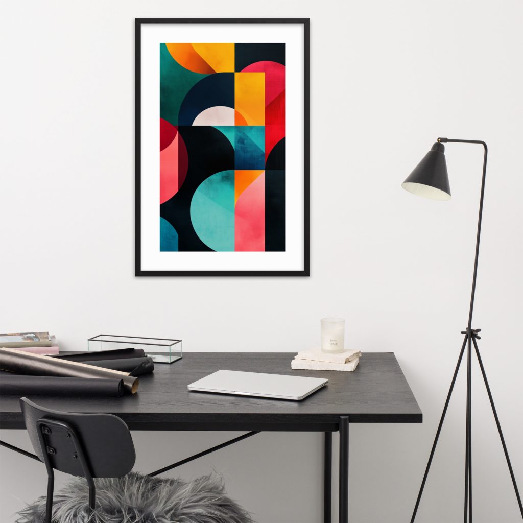 A modern office desk setup with colorful geometric artwork on the wall.