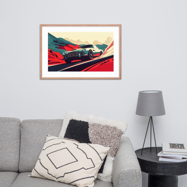 Modern living room with framed car artwork, gray couch, and round side table.