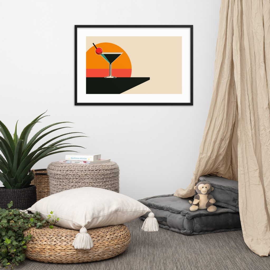 Cozy reading nook with a modern framed cocktail artwork on the wall.