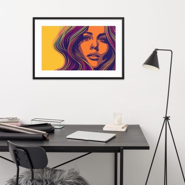 A modern workspace with a colorful framed artwork of a woman's face above a desk.