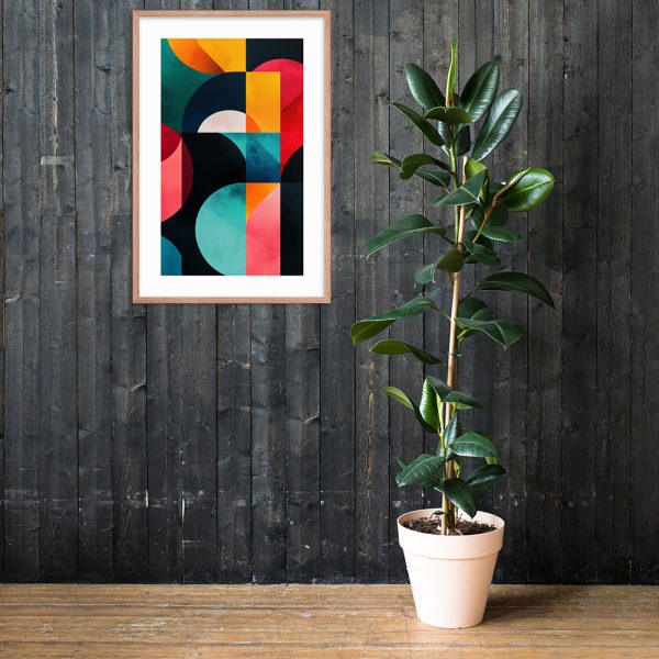 A framed abstract artwork and a potted rubber plant against a dark wooden wall.