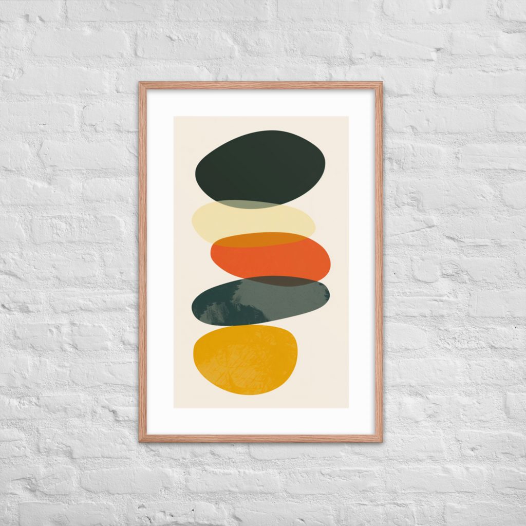 Abstract colorful shapes framed artwork on a textured white brick wall.