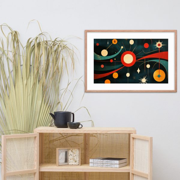 Framed abstract artwork with geometric shapes above a wooden cabinet.