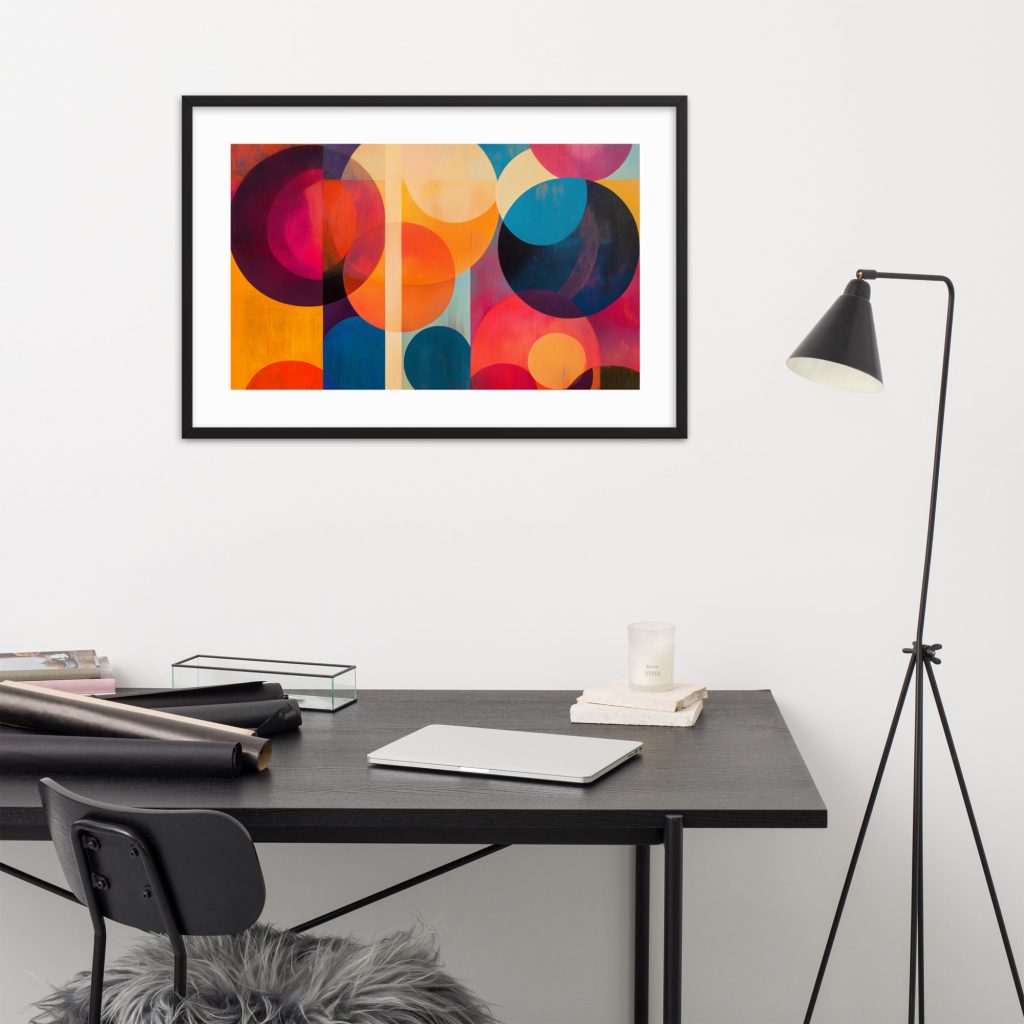 Framed geometric abstract art above minimalist desk setup.