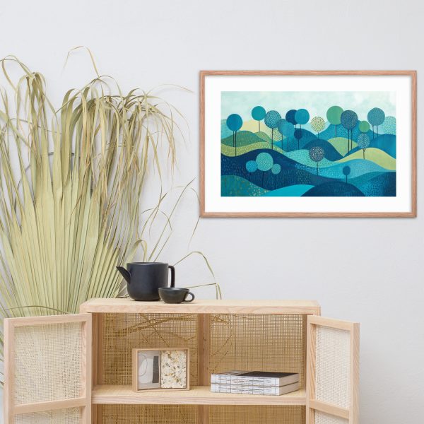 Framed landscape artwork above modern cabinet with decor.