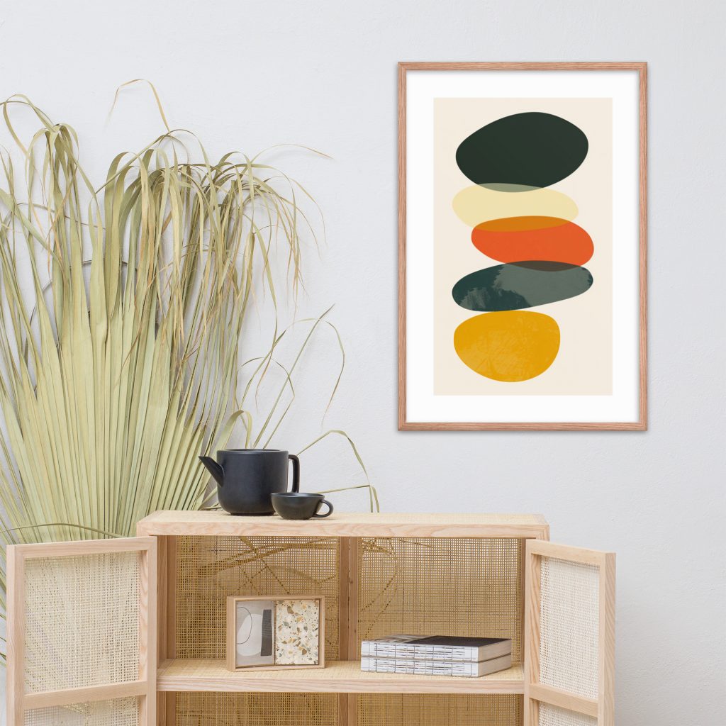 A minimalistic room with abstract artwork, modern wooden cabinet, and decorative plant.