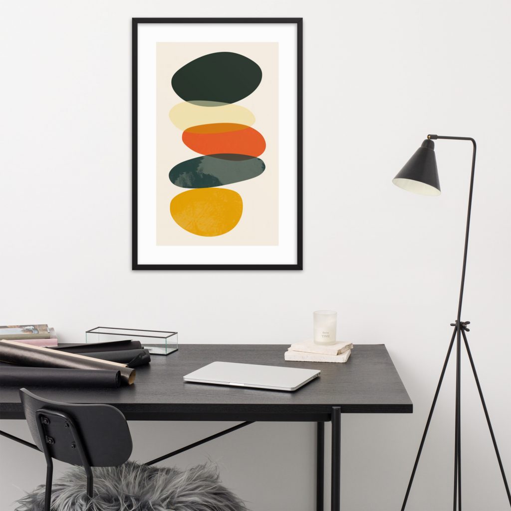 Minimalist workspace with modern geometric artwork on the wall.