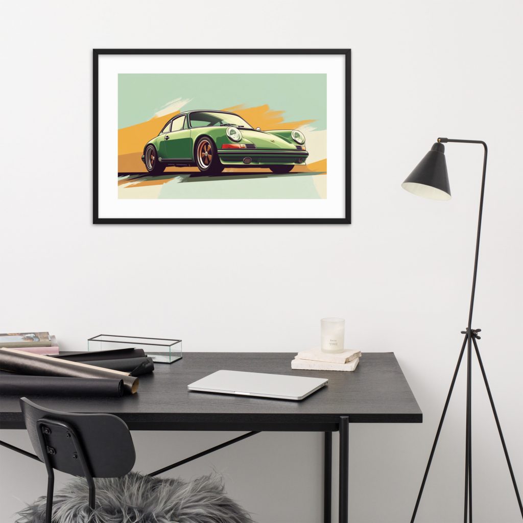 Framed vintage car artwork above modern desk setup.